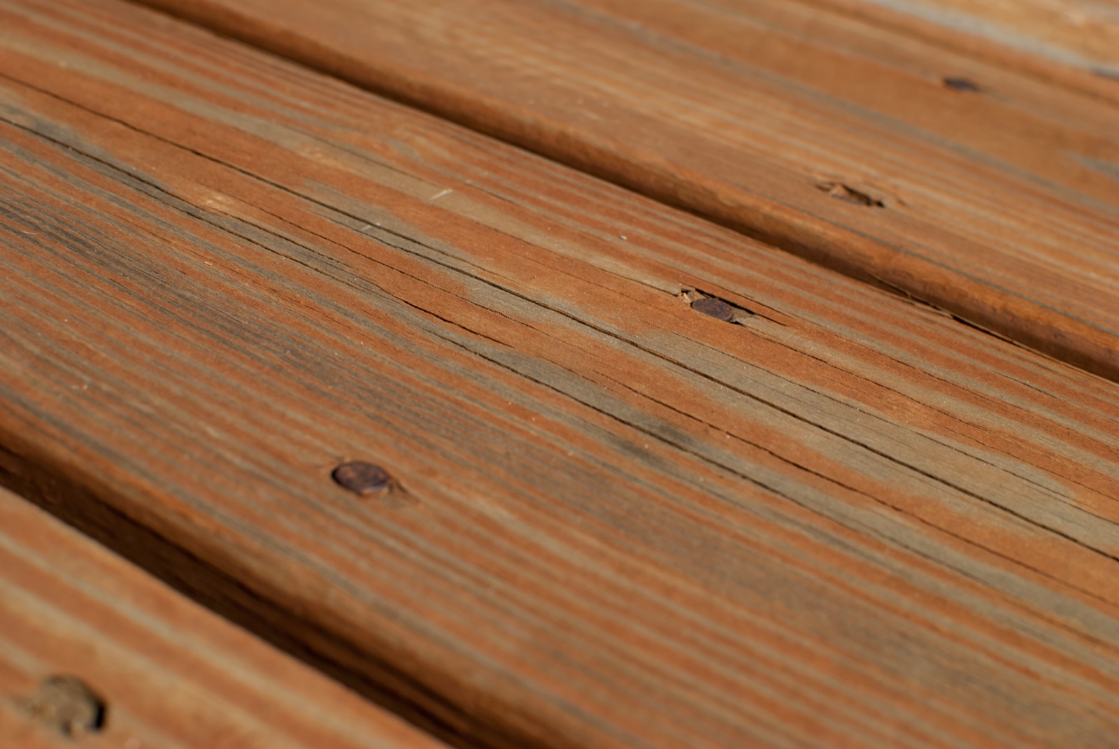 Freshly stained wood deck boards