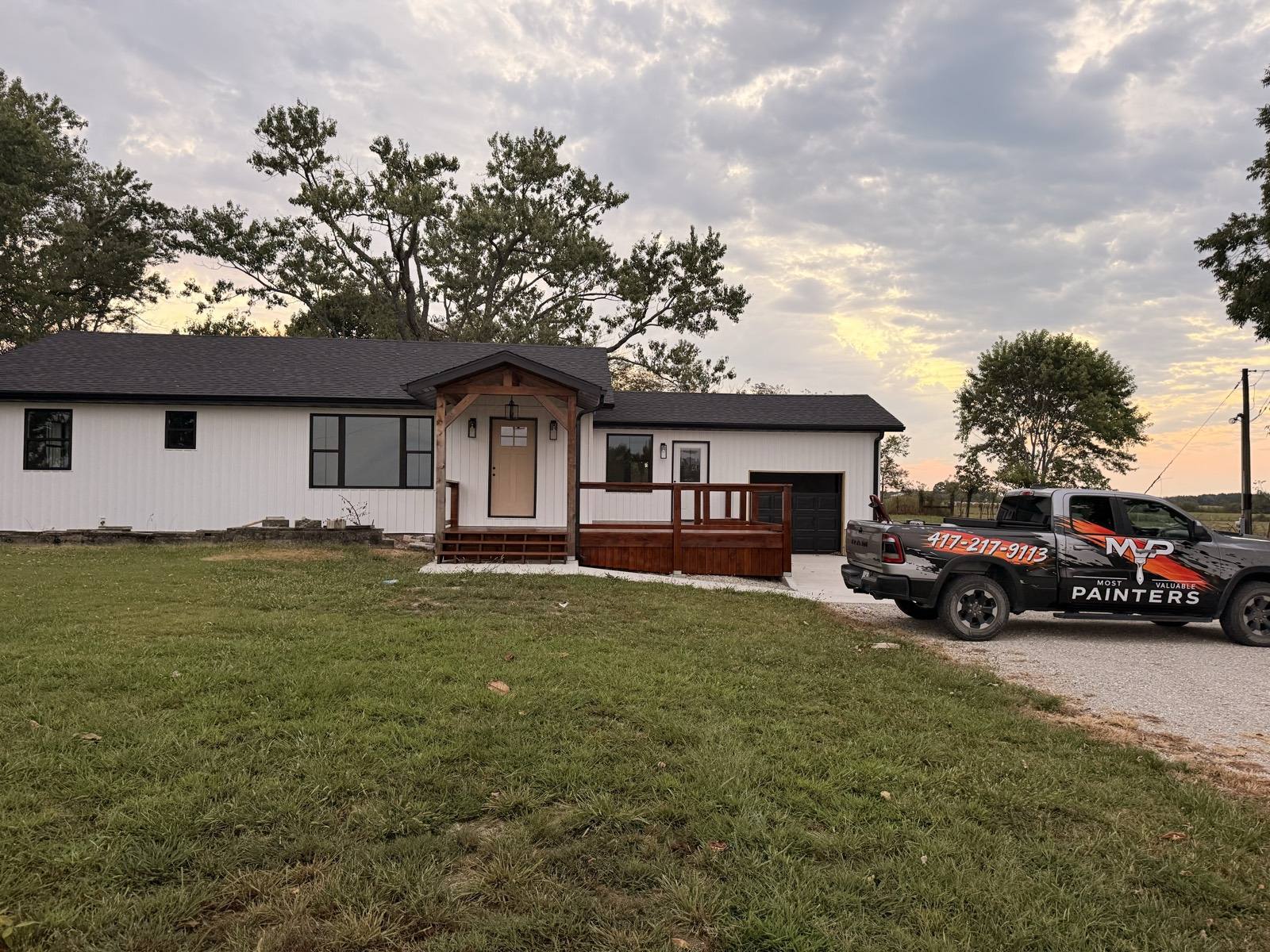 Same home after deck staining by Most Valuable Painters in Mountain Grove, MO