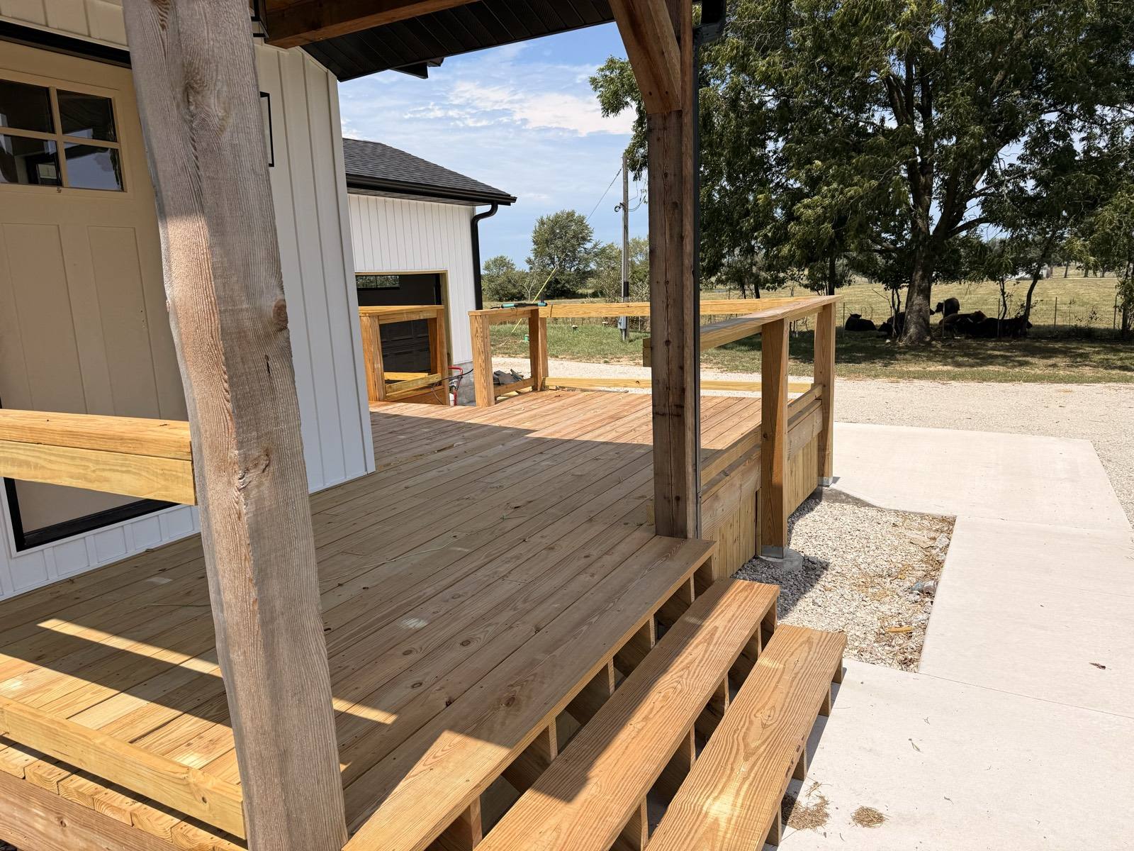 Unstained covered porch and deck steps before staining in Mountain Grove, MO