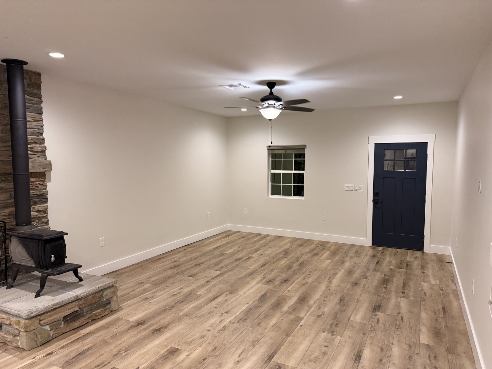 Freshly painted living room interior with off-white walls and white trim in Mountain Grove, MO